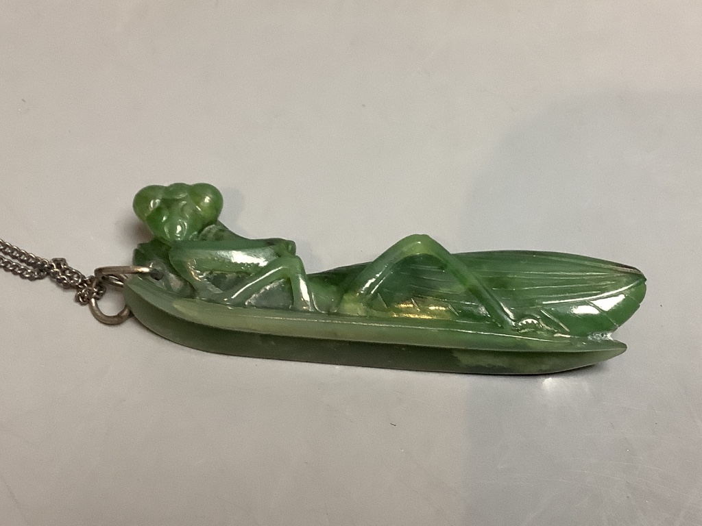 A Chinese jadeite pendant , a pair of bangles, earrings and a cricket pendant